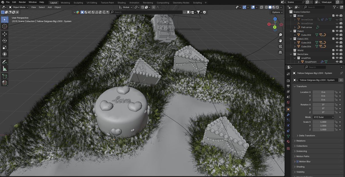 Blender viewport screenshot — greyscale clay scene with the heart cake, gift box and cookies on a hilly grass terrain